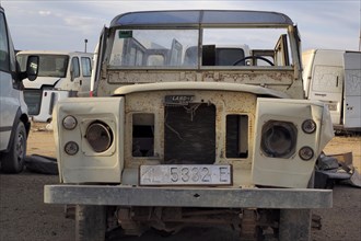Front view of beige scrapped Land Rover