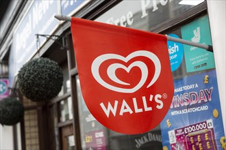 Wall's ice cream red sign outside newsagent shop