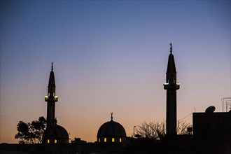 Silhouette of minarets and domes on a Mosque part of the skyline of Tripoli