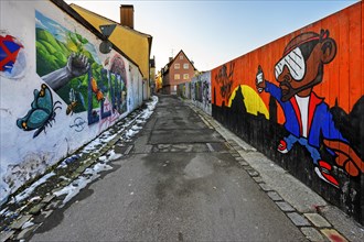 Narrow alley with graffiti