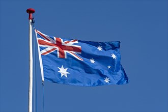 Australian flag against a blue sky