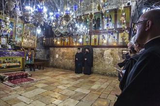 The rare annual public encounter of Orthodox monks and Roman Catholic priests for the feast of St. Mary in the church of the sepulcher of St. Mary also known as the tomb of the virgin in Jerusalem