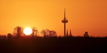 Sunrise over the city skyline with the Colonius telecommunications tower and the cathedral