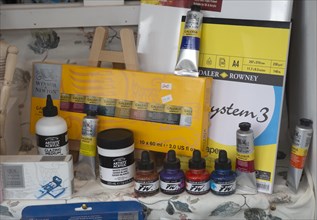 Display of various art materials in shop window