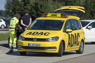ADAC breakdown service checks defective car at motorway service area on A8 motorway