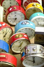 Old alarm clocks for sale at a flea market