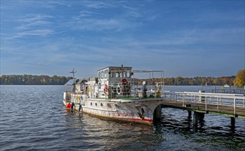 Old boat on a jetty of the Tegeler See