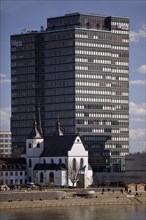 Alt St. Heribert in front of the Lanxess AG high-rise