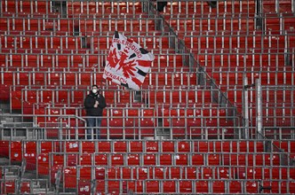 Lone fan of Eintracht Frankfurt SGE with flag