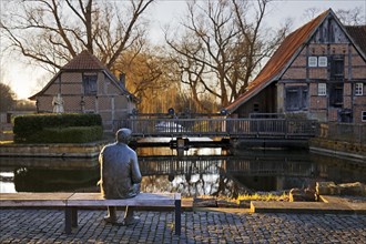 Bronze sculpture of the local poet Paul Advena at the water mill in Heek-Nienborg