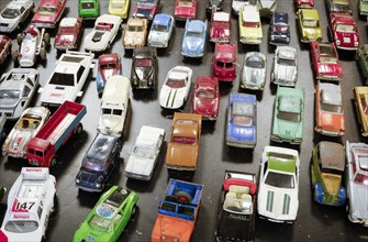 Old metal toy cars for sale at a flea market