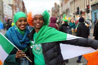 All smiles and Irish pride in the green and gold tricolour after the parade on Saint Patrick's day