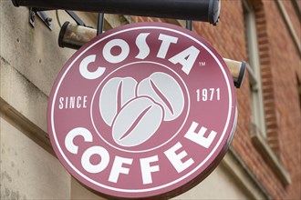 Close up of Costa Coffee trademark sign mounted on a wall