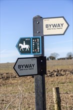 Byway and bridleway signpost showing public rights of way