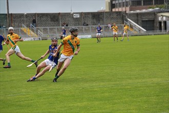 GAA player with hurley and ball during a game as Lixnaw win Kerry county hurling county final