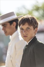 Portrait of young men in traditional clothes during the Feria de Abril in Seville