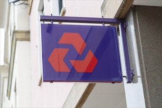 NatWest bank sign on wall outside branch