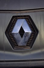 Renault car logo on dirty front panel