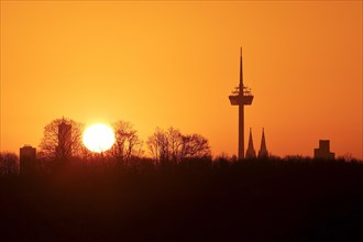 Sunrise over the city skyline with the Colonius telecommunications tower and the cathedral