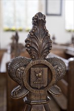 Carved wooden pew end by P Palmer 1850