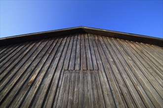 Wooden wall of a barn with sky