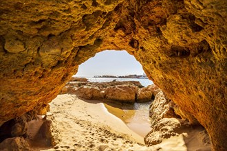 Beautiful sandstone arch with the view on marina in Portimao