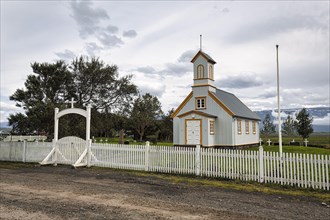 Small wooden church with cemetery