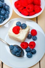 Fresh homemade raspberry and blueberry cream cake