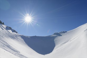 Karwendelgrube Karwendel mountainrange with sun in winter