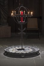 Iron rack with sacrificial candles