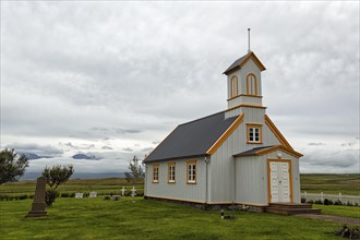 Small wooden church with cemetery