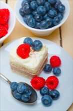 Fresh homemade raspberry and blueberry cream cake