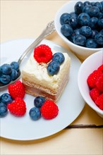 Fresh homemade raspberry and blueberry cream cake