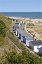 Coastline in summer sandy beach and beach huts
