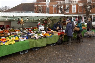 Market stall in town centre selling fruit and vegetables