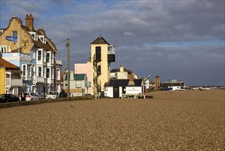 Shingle beach view of two watchtowers