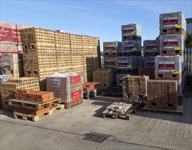 Piles of bricks in Jewson builders merchant yard