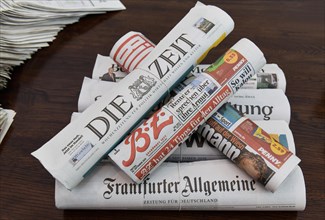Stack of various newspapers
