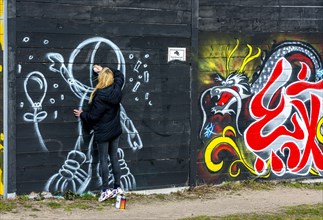 Sprayer creating a graffiti design