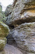 Hiking trail through rock crevice in Bieletal