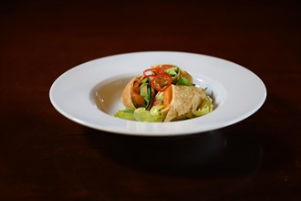 Mediterranean spring roll served on a white plate