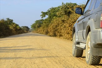Off-road vehicle on the dusty Transpantaneira