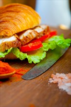 Savory croissant brioche bread with chicken breast and vegetable rustic style