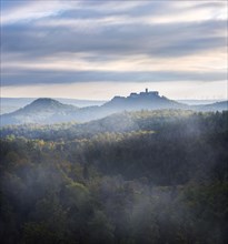 View from the Rennsteig over the Thuringian Forest to Wartburg Castle in the morning light in autumn