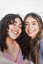 Close up of two cute girls taking a selfie
