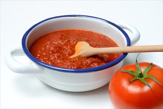 Bowl with tomato sauce