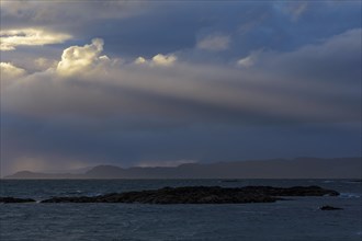 Scottish coast at sunset with sunrays