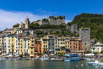 Pastel-coloured house facades in the harbour of Portovenere