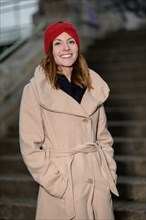 Smiling pretty young woman with long brunette hair