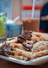 Stir-fried rice noodles with beef in a Cantonese restaurant in Macau